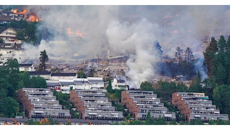 At least 100 homes destroyed in a fire in Norway; explosions were heard